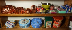 lot 239 image: Copper Kitchen Wall DeCor, Colander, Holiday Birthday Candles and Supplies, Cookie Tins Etc.
