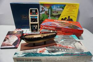 lot 449 image: Collection of Vintage Games Including U.S.S. Frigate CONSTITUTION Wood Ship Model Scientific Collectors Series, 1974 Monopoly, All About St. Cloud Game and more