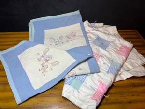 lot 727 image: Vintage Baby Cross-Stitched and Quilted Crib Blankets...