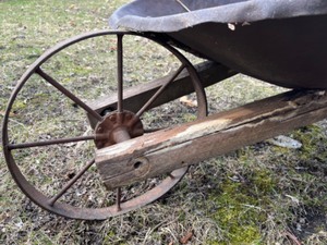 lot 700C image: Antique Wheel Barrel wSteel Wheel and Wood Dowel Nails