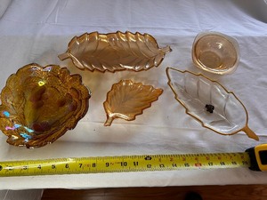 lot 58 image: Variety of Amber Carnival Glass Leaves, Vintage Indiana Carnival Glass Marigold Candy Dish, and Jeanette Glass Irredescent Floragold Dish