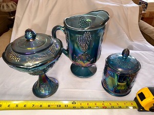 lot 60 image: Vintage 1970s Indiana Glass Electric Iridescent Blue Carnival Glass Harvest Grape Pitcher, Covered Candy Dish, and Small Covered Candy Dish