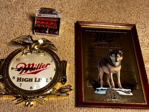 lot 207 image: Miller Light Wall Clock, Lighters, and Timberwolves Mirrored Art
