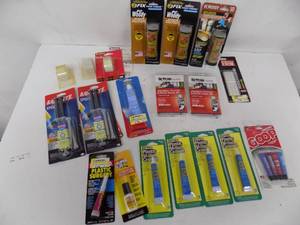 lot 84 image: Lot of - glue  epoxy  cement  tape