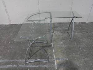 lot 107 image: L Shaped Metal Frame Glass Top Work Station 31 x 19-34 x 29-May Need Adjustment  Reassembly