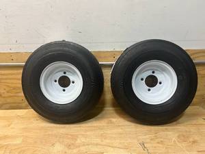 lot 115 image: CARRY-ON Lot of 2- 12 in 4.80-12 Bias 6-Ply Trailer Tires and White Mod Wheel 5 Lug on 4.5 in (Retails for $87.99 each)