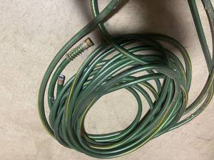 lot 48 image: Green Outdoor Garden Hose with Brass Fittings