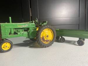 lot 74 image: Vintage John Deere Die-Cast Tractor and Red Farm Tractor with Green Trailer Toy Set