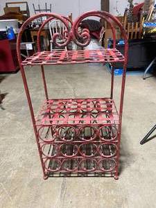 lot 113 image: Vintage Red Metal Wine Rack with Heart Scroll Details