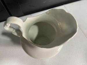 lot 127 image: Vintage White Ceramic Water Pitcher with Embossed Detail