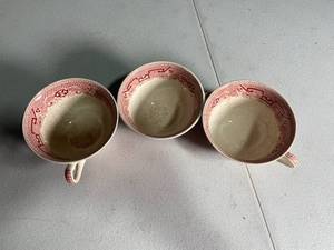 lot 232 image: Set of 3 Red Transferware Porcelain Teacups with Asian-Inspired Pattern