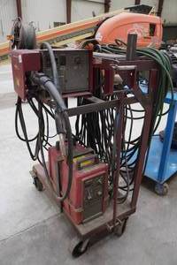 lot 7 image: Cyclomatic Powcon 300-SM StickMig Welder on Cart with Wire Feeder and RegulatorHose