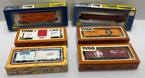 lot 196 image: Misc. Vintage HO Scale Train Cars In Original Boxes Including Montgomery Wards And More (Some Boxes Beat Up)