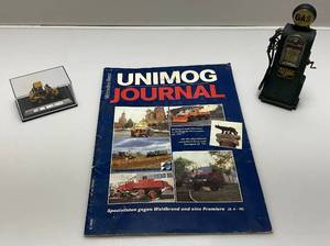 lot 206 image: Vintage Misc. Items Including Miniature Cat 906 Wheel Loader, Resin Gas Pump & Vintage Unimog Journal