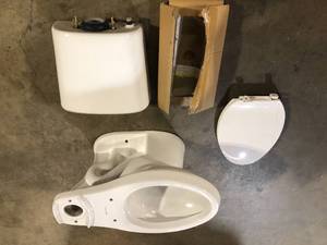 Glacier Bay 2-Piece 1.1 GPF1.6 GPF High Efficiency Dual Flush Complete Elongated Toilet in White   Customer Returns See Pictures