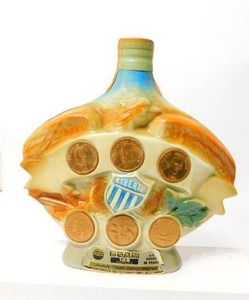 lot 35 image: Rare Full Jim Beam Decanter wOriginal Coins Cork Bottom Embossed Creation of James B. Beam Distilling Company KY-CR8-220 General Regal China 1970 C. Miller.