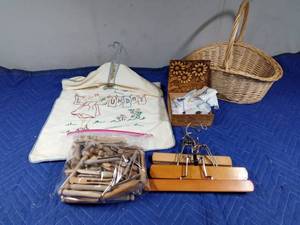 lot 68 image: Vintage clothes pins and embroidered clothes pin bag, pant hangers, handkerchief wooden box with handkerchiefs and basket