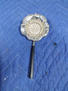 lot 100 image: Sterling silver tea strainer