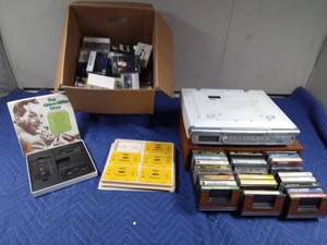 lot 122 image: Case and box of cassettes and a undercounter CDradioclock