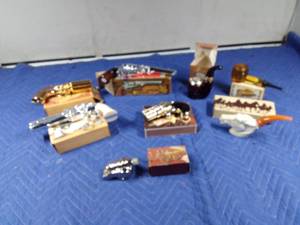 lot 140 image: Avon Guns, pipes, and cannon bottles