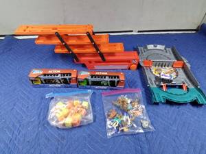 lot 144 image: Hot Wheels carrier trailer, 2 new Action semi carriers, train track in case and more