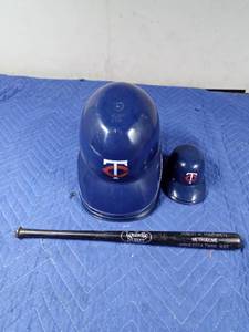 lot 157 image: 1982 Louisville Slugger bat from Hubert Humphrey Metrodome and Twins hard plastic hats