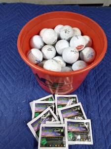 lot 160 image: Pail of golf balls and golf light sticks