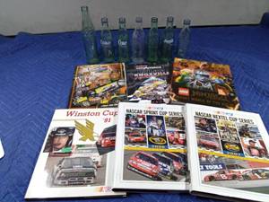 lot 197 image: Nascar books, Ninjago Lego book and coke bottles