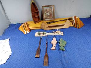 lot 353 image: 2 shelves, canoe shelf, boat shelf, and a paddle with hanging decor