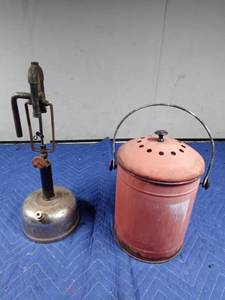 lot 381 image: Vintage Lantern style torch and vintage coal heater