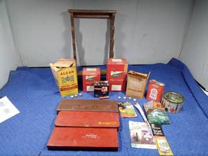 lot 423 image: 12 gauge felt wads, 3 rifle cleaning kits, 12 gauge empty shells in box, gun rack and more