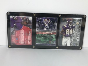lot 488 image: 3 - Randy Moss Football Cards in Display Case