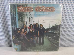 lot 9 image: (FS) 1973 Lynyrd Skynyrd Pronounced Leh-Nerd Skin-Nerd Album - Jacket and Record Individually Sleeved and Record On Outside of Jacket