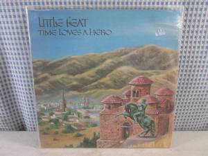 lot 59 image: (FS) 1977 Little Feat Time Loves A Hero Album - Jacket and Record Individually Sleeved and Record On Outside of Jacket