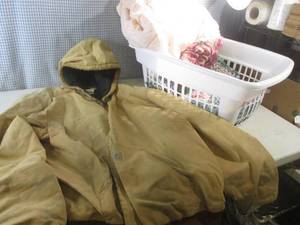 lot 94 image: (G-1) Laundry Basket with Blankets and Carhartt Coat Size 2XL