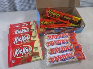 lot 319 image: (C-1) Box of 12 King Size Candy Bars 4 Each of Kit Kat, Pay Day and Reeses Peanut Butter Cups Best by Date Vary March - Aug 2024