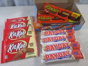 lot 322 image: (C-1) Box of 12 King Size Candy Bars 4 Each of Kit Kat, Pay Day and Reeses Peanut Butter Cups Best by Date Vary March - Aug 2024