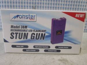 lot 435 image: (CNTR) Monster Rechargeable LED Flashlight Stun Gun in Purple Model 36M - New In Box