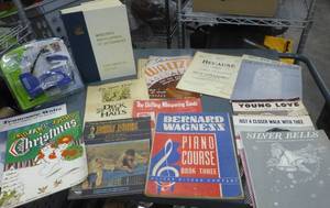 Piano music, dictionary, kids books, old military photo