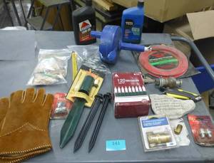 Various garage items, oil, drain snake, wood dowels, new suede leather lined gloves, stakes, lights, saw blade