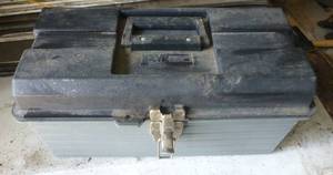Toolbox with various tools including an adjustable reamer and a ac meter