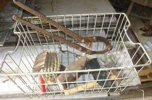 Vintage fence stretcher, axe, horse grooming items and wire basket