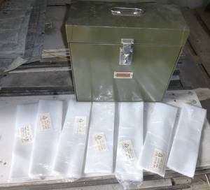 700 small 3x10 poly bags and a metal filing cabinet