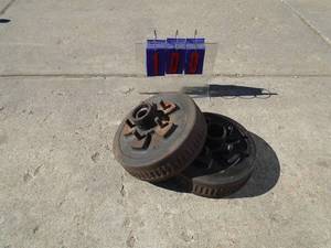 Qty of 2 9 trailer brake drums & hubs. 5 stud. Used condition. As shown.