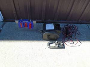 2000 lb winch with control cables. Tested & works. As shown.