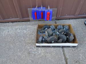 Flat of casters. As shown.
