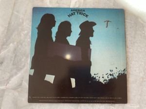 lot 100 image: America - Hat Trick - VINYL Record LP Album.