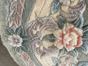 lot 28 image: Vintage Handmade Sage Green With Pink Roses 69 L x 45 W Oval Rug