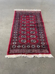 lot 30 image: Vintage Red Rectangular Machine Made Rug 64 L x 37 W