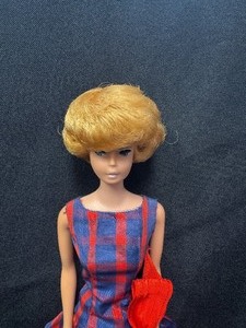 lot 6 image: Vintage Bubblecut Barbie Wearing Red and Blue Taffeta Dress